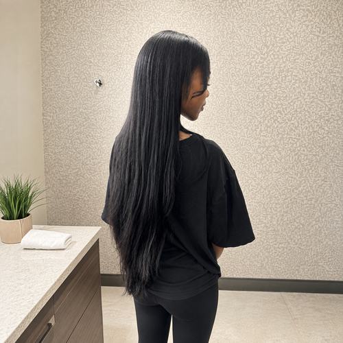 Long, sleek 26-inch traditional sew-in at Amour by RenaeJ in Southwest Houston